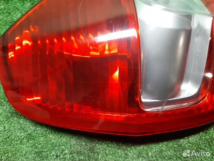 Фонарь задний наружный левый Honda Jazz 2004