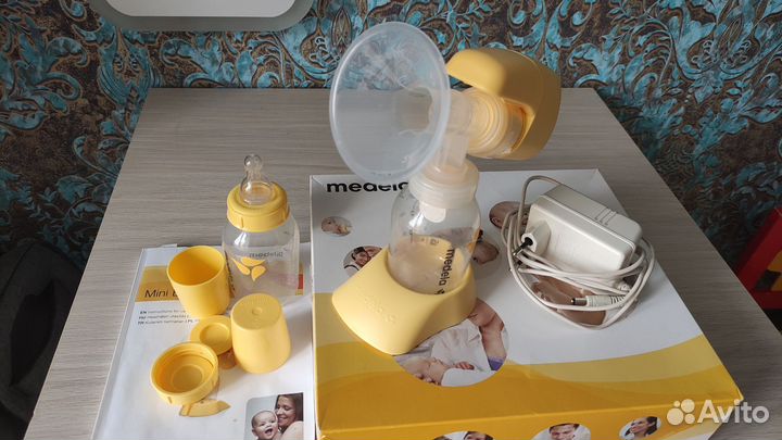 Молокоотсос medela электрический