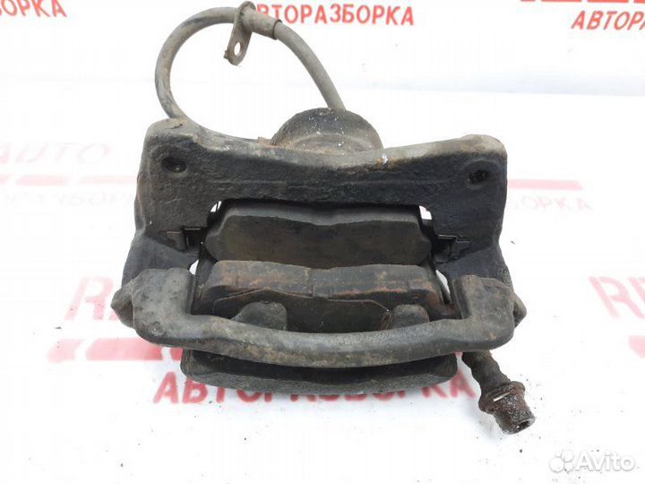 Суппорт тормозной передний левый Toyota Carina