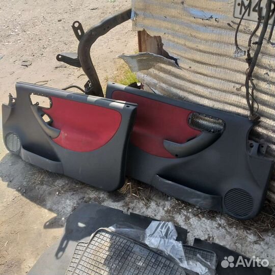 Обшивка двери opel corsa c