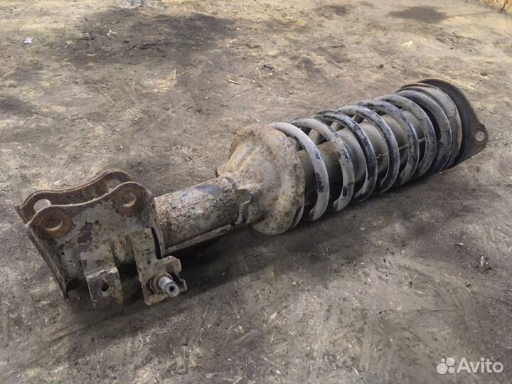 Стойка подвески передняя левая Kia Avella седан