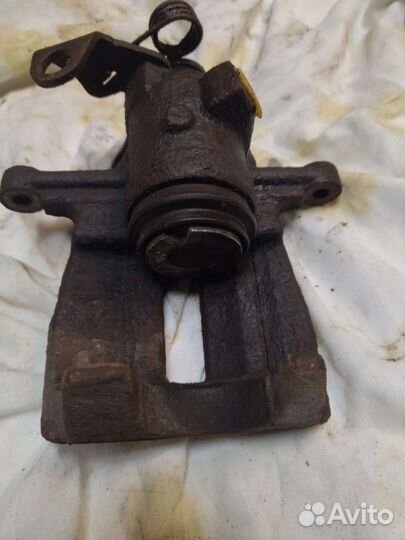 Суппорт тормозной задний левый Volkswagen