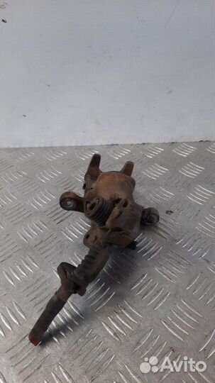 Суппорт тормозной задний левый Hyundai Coupe купе