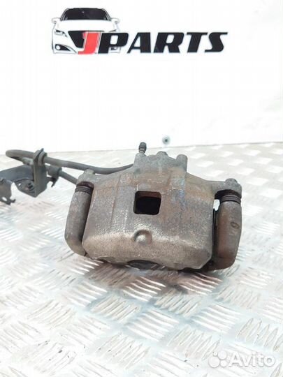 Суппорт тормозной передний Mitsubishi Lancer