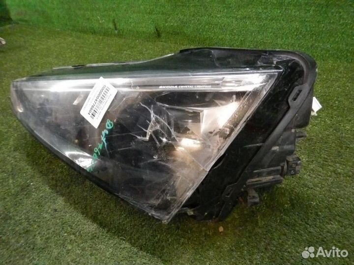 Фара левая Skoda Rapid