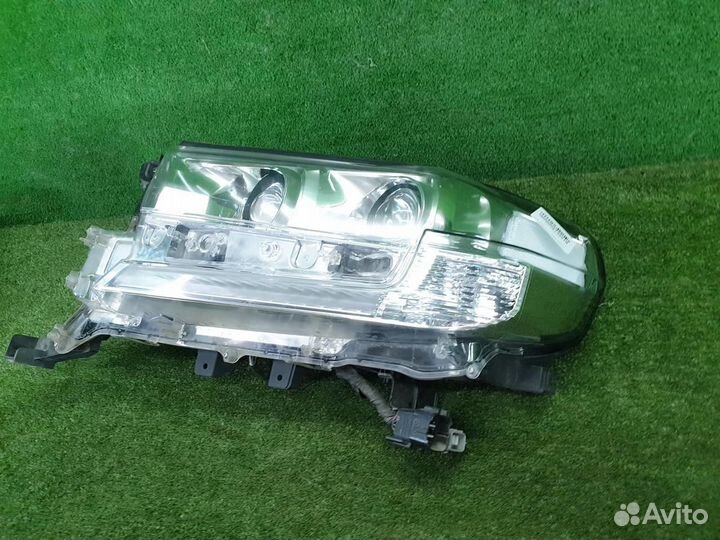 Фара левая Toyota Land Cruiser