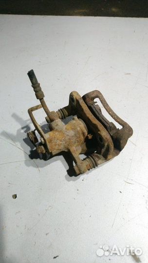 Суппорт тормозной задний левый Kia Rio 3 2013