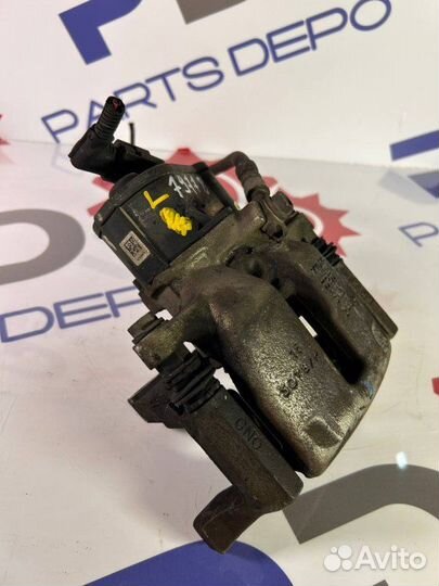 Суппорт тормозной задний левый Vw Passat B7 1.4