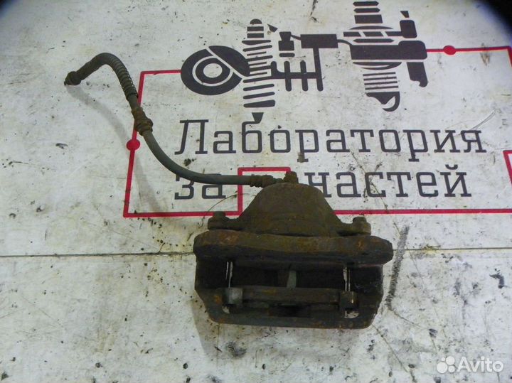 Суппорт тормозной передний левый Hyundai Tucson