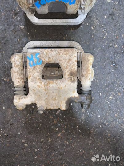 Суппорт тормозной задний Nissan Qashqai J10