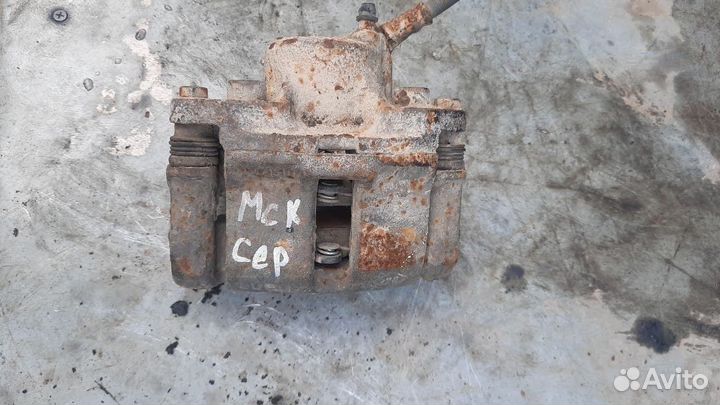 Суппорт тормозной передний левый Renault Logan