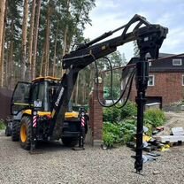 Экскаватор погрузчик с буром