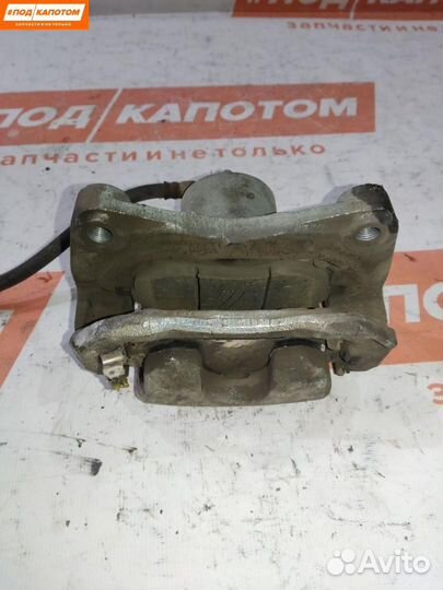 Суппорт тормозной передний левый Nissan Teana J32