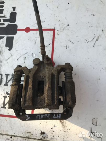 Суппорт тормозной задний левый Nissan Pathfinder