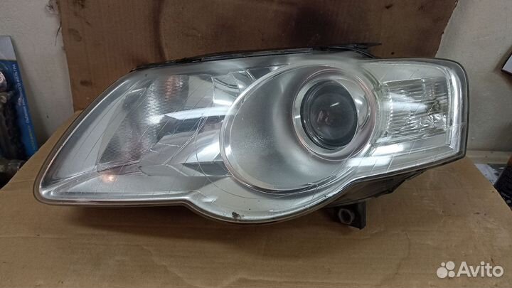 Фара левая WV Passat B6