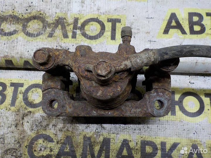 Суппорт задний левый Nissan Tiida (C11) 2004-2014