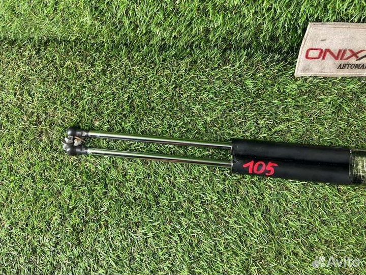 Амортизатор задней двери Mazda Familia vzny12