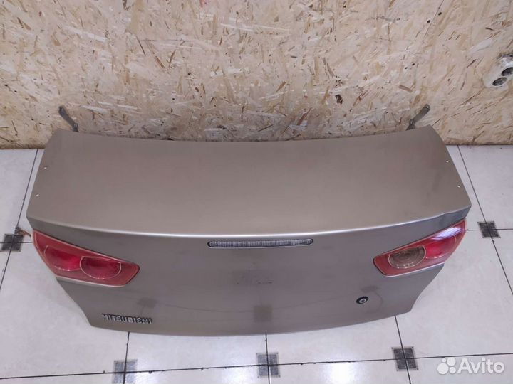 Лансер 10 крышка багажника