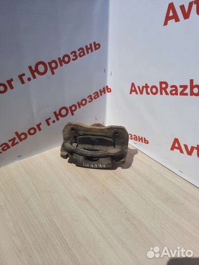 Суппорт передний левый Kia Carens 02-06г.в