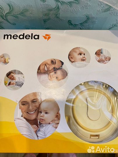 Молокоотсос medela электрический
