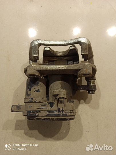 Суппорт(задний левый) (Hyundai Sonata viii DN8)