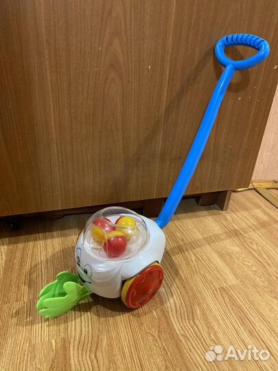 Игрушка каталка с ручкой