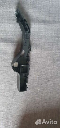 Кронштейн крепления бампера переднего правый