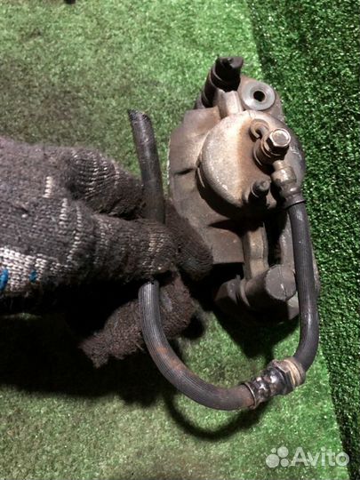 Суппорт тормозной передний левый Mazda Premacy