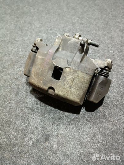 Суппорт тормозной передний левый Mitsubishi Lancer