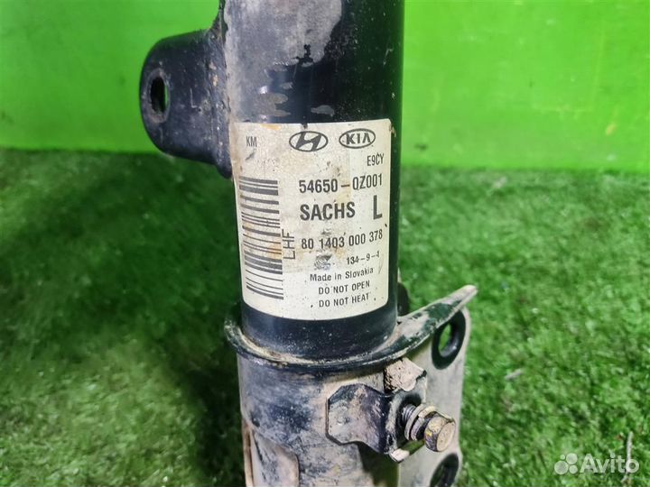 Стойка амортизатора передняя левая KIA Sportage 2
