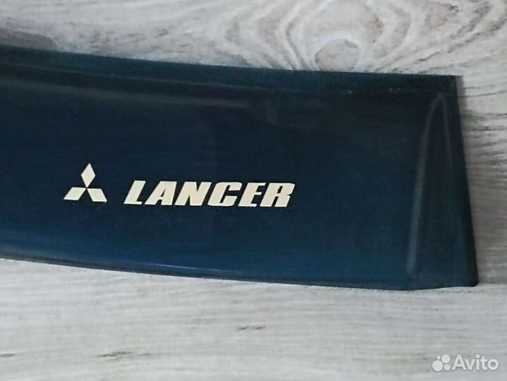 Дефлектор (козырек) заднего стекла lancer 9