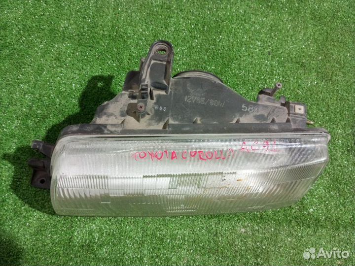 Фара галогеновая левая Toyota Corolla AE91