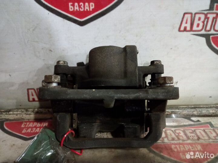 Суппорт тормозной задний левый Toyota Alphard