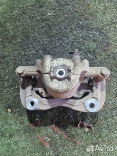 Суппорт тормозной передний Kia Rio хетчбек G4FC