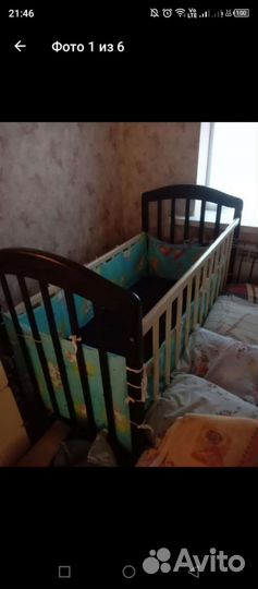 Детская кроватка с маятником