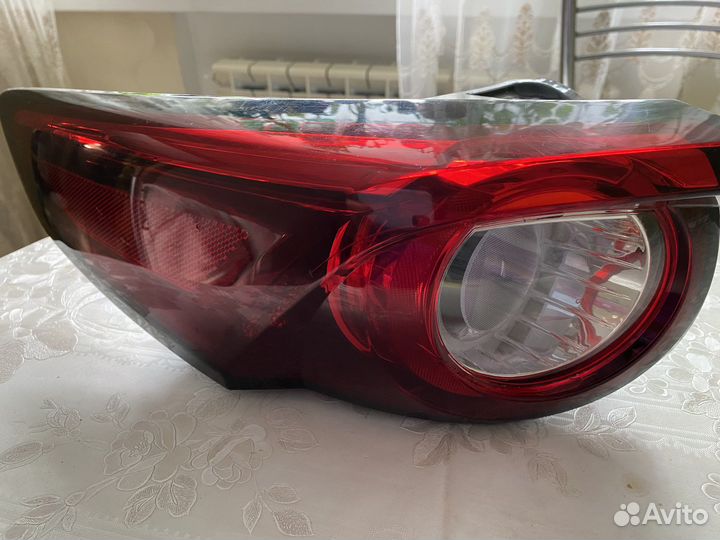 Фонарь задний mazda 9сx левый
