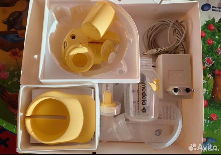 Молокоотсос medela электрический