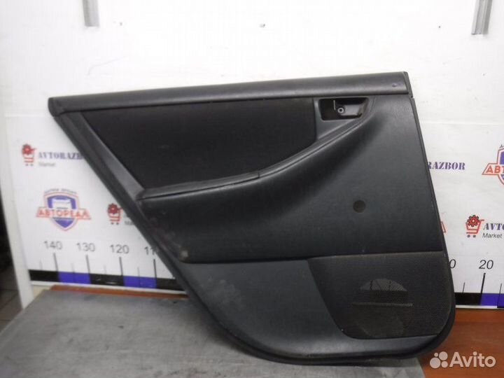 Обшивка двери задняя левая Toyota Corolla 120 4ZZ