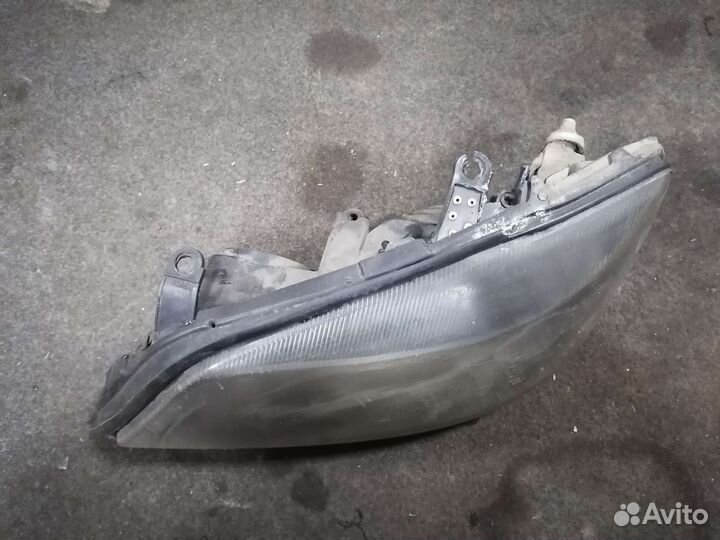 Фара левая Opel Astra G