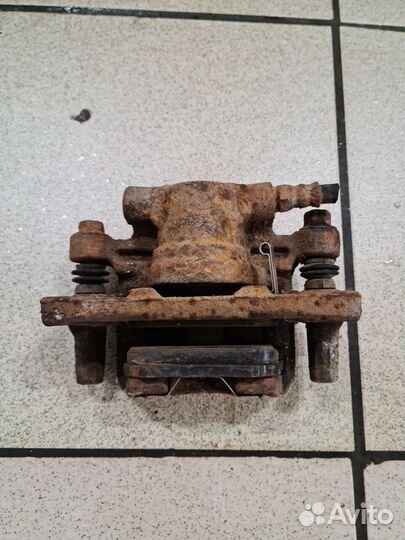 Суппорт передний задний Mitsubishi Lancer X