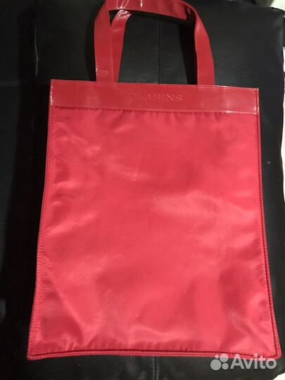 Новые чехлы Prada, косметички и сумка Clarins
