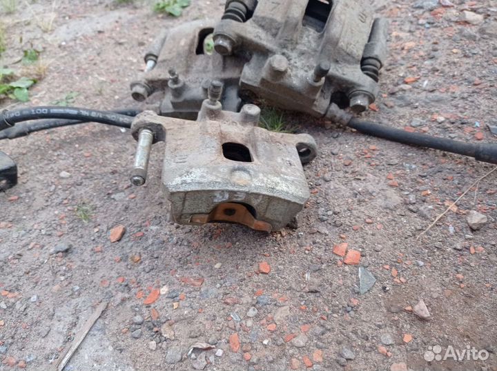 Задние суппорта на митсубиси лансер 10