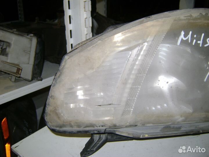 Фара передняя левая Mitsubishi L200 KB