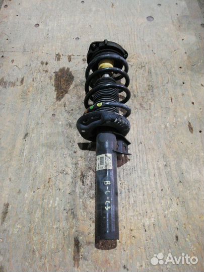 Стойка амортизатора передняя Volkswagen Passat B6