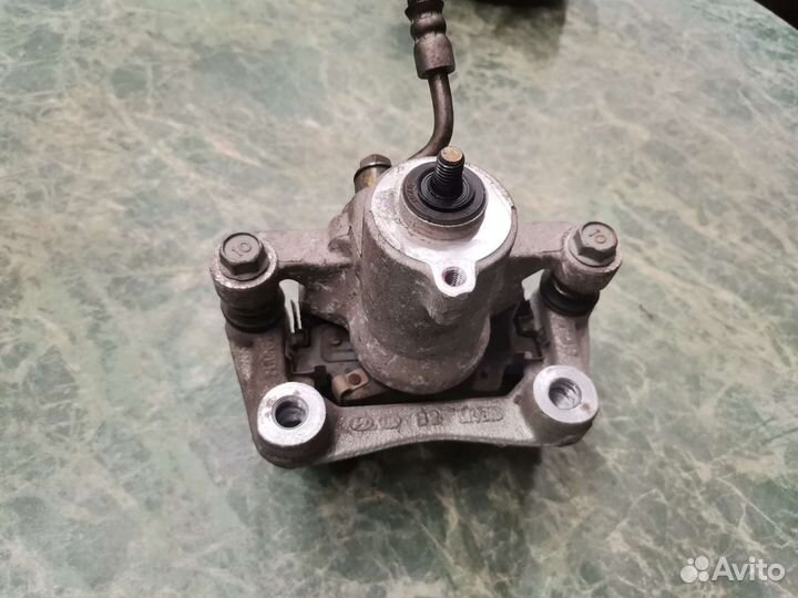 Суппорт задний левый Kia K3