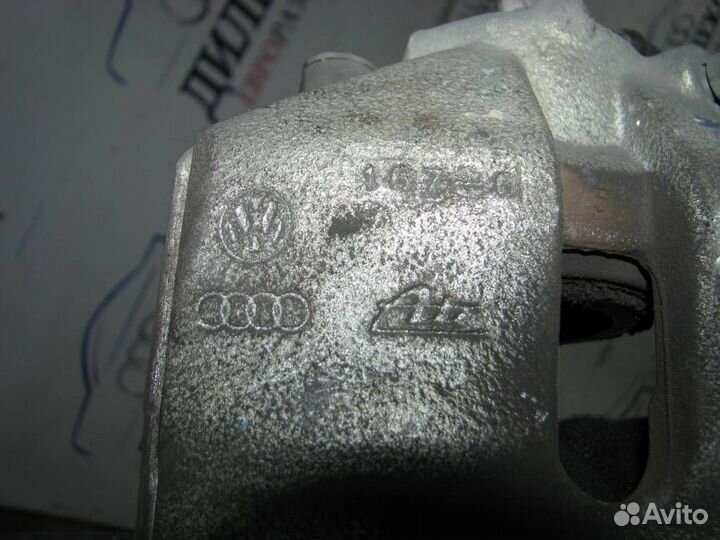 Суппорт передний левый VW Passat (B6) 2005-2010