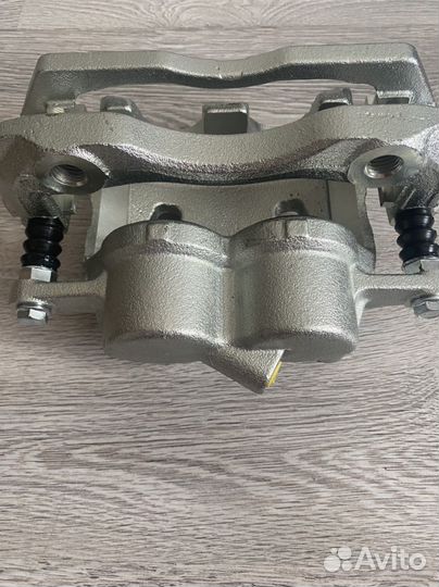 Суппорт тормозной передний газ next