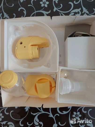 Молокоотсос medela электрический