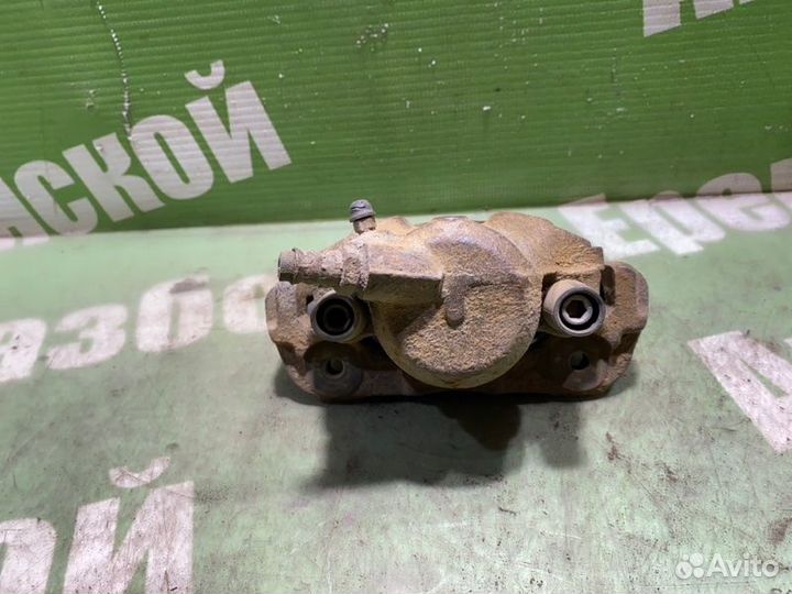 Суппорт тормозной передний левый Kia Shuma