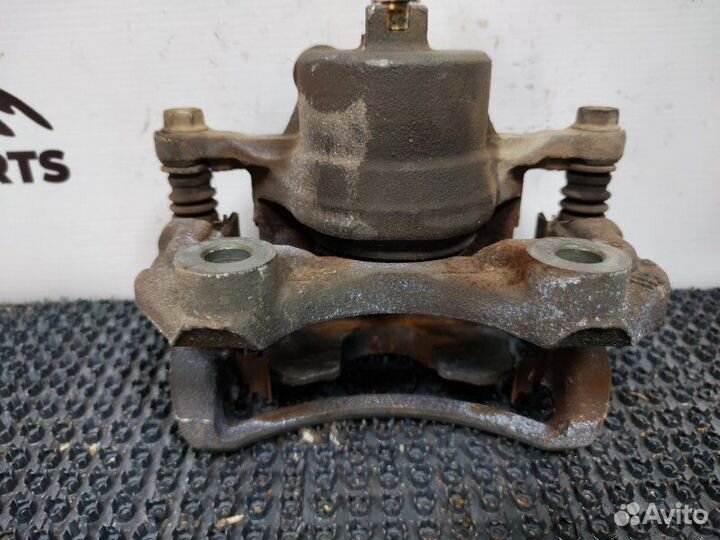 Суппорт тормозной передний левый Nissan Avenir